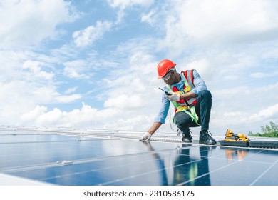 African American engineer maintaining solar cell panels on factory building rooftop. Technician working outdoor on ecological solar farm construction. Renewable clean energy technology concept - Powered by Shutterstock