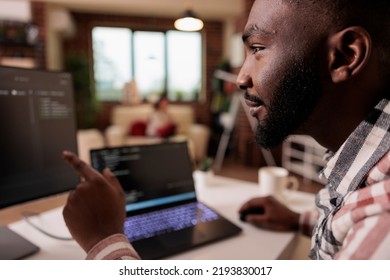 African american it engineer programming binary code interface, using css html script and encryption on computer. Male freelancer coding security server with software developer application. - Powered by Shutterstock