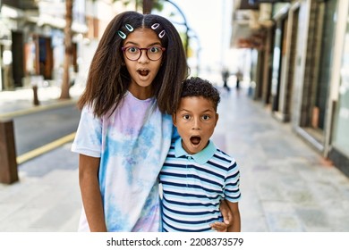 African American Family Of Bother And Sister Standing At The Street Scared And Amazed With Open Mouth For Surprise, Disbelief Face 