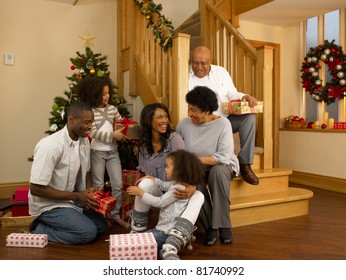 African American Family Exchanging Christmas Gifts