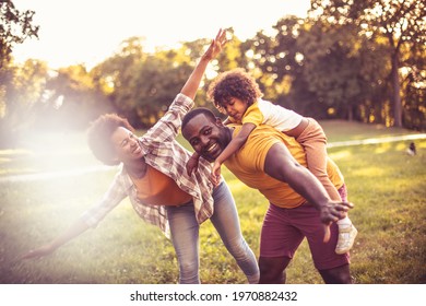  African American Family Having Fun Outdoors.