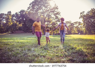 African American Family Having Fun Outdoors.