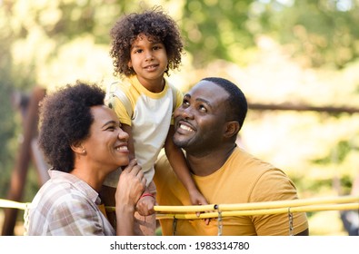  African American family having fun outdoors.