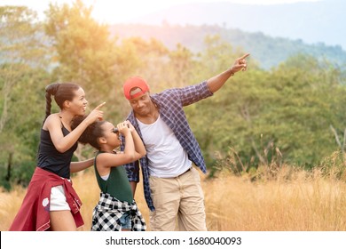 African American Family On Hiking Adventure Through Forest. Group of African American Family Walking in Jungle. Family On Hiking Adventure Through Woods.