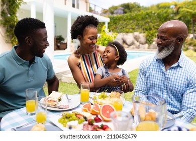 African american family spending leisure time together at backyard during brunch. family, love and togetherness concept, unaltered. - Powered by Shutterstock