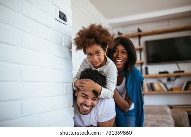 African American Family Spending Quality Time At Home Together.