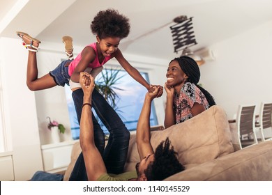 African American Family Spending Time Together At Home. They Are Having Fun