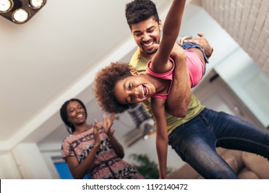 African American Family Spending Time Together At Home. They Are Having Fun