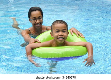 African American Family In A Swimming Pool