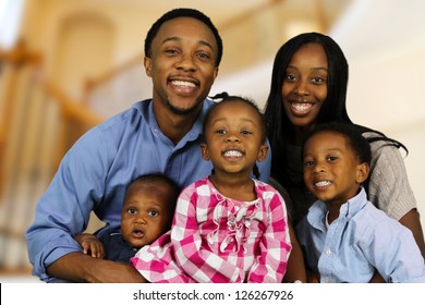 African American family together inside their home