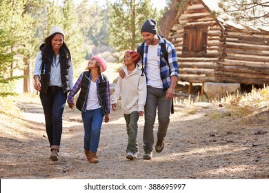 African American Family Walking Through Fall Woodland