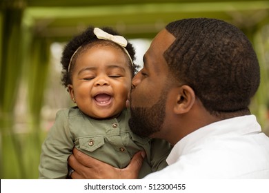 African American Father And Daughter.