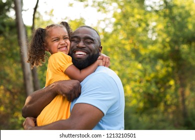African American father and his little girl.