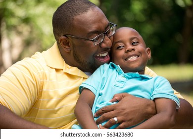 African American Father And His Son.