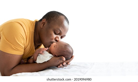 An  African American Father Kissing His 12-day-old Baby Black Skin Newborn Son, With Happy And Love, On White Isolated Background, Concept To African American Family And Baby Newborn