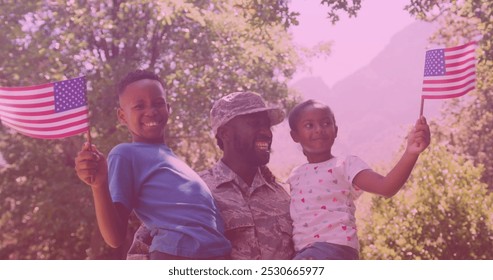 African american father in soldier uniform carrying his son and daughter in the garden. family, love and togetherness concept - Powered by Shutterstock