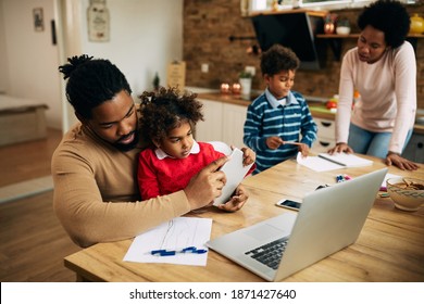 African American Father Working On Touchpad Stock Photo 1871427640 