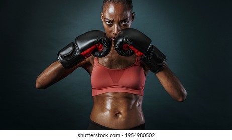 African American Female Boxer Looking Strong