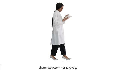 African American female doctor holding a tablet computer while w