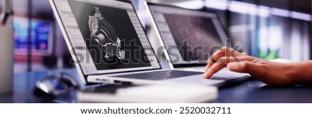 African American Female Engineer Developing Mechanical Parts Using 3D CAD Software on Laptop at Factory Office