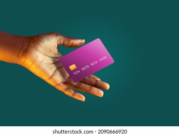 African american female hand holds levitating template mockup Bank credit card with online service on green background