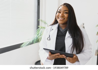 An African American female medical doctor with a stethoscope in hospital