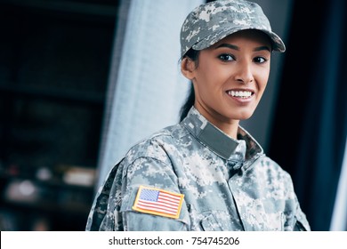 african american female soldier in military uniform with usa flag emblem