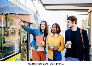 African american female traveler asking for help woman with at tram stop. Young black woman tourist asking for directions and help from local people in tram stop outdoor.