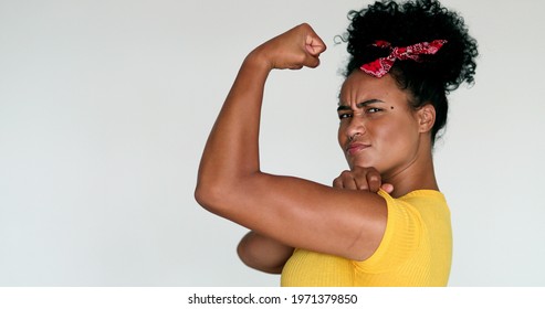 African American Feminist Woman Posing To Camera Doing We Can Do It Gesture With Arm