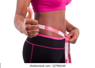 African American Fitness woman making thumbs up, isolated on white background