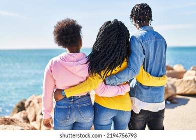 African American Friends Hugging Each Other On Back View At Seaside