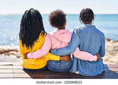 African American Friends Hugging Each Other On Back View At Seaside