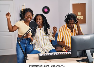 African american friends musicians group singing song at music studio - Powered by Shutterstock