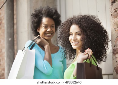 African american friends with shopping bags
