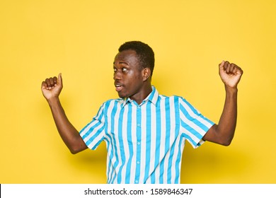 African American gesticulating with a striped shirt cropped look