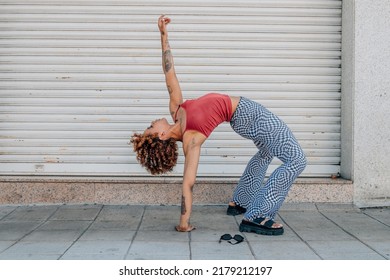 african american girl contortionist in the street