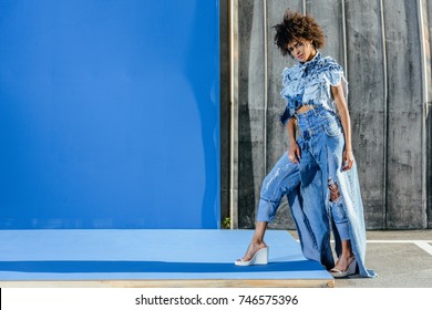 African American Girl In Denim Clothes Posing For Fashion Shoot