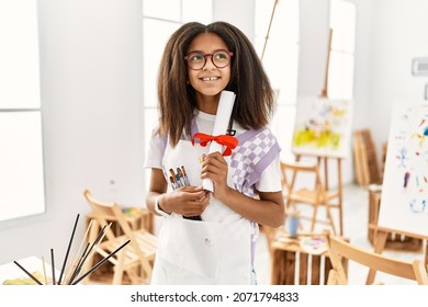 African American Girl Holding Diploma Drawing At Art School