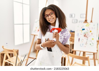 African American Girl Holding Diploma Drawing At Art School