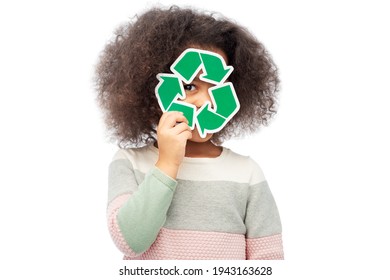 african american girl holding green recycling sign - Powered by Shutterstock