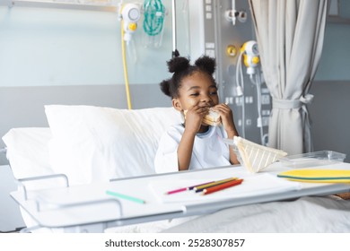 African american girl patient lying on bed eating sandwich in patient room at hospital. Hospital, childhood, medicine and healthcare, unaltered. - Powered by Shutterstock