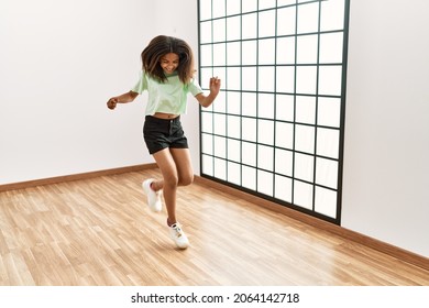 African American Girl Smiling Confident Dancing At Dance School