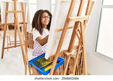 African american girl smiling confident drawing at art school