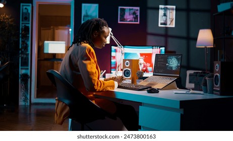 African american girl uses artificial intelligence software for machine learning and cloud computing, terminal window programming language. IT student studying deep learning AI hardware. Camera B. - Powered by Shutterstock