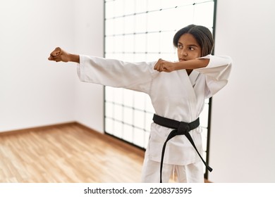 African American Girl Wearing Kimono Training Karate At Sport Center