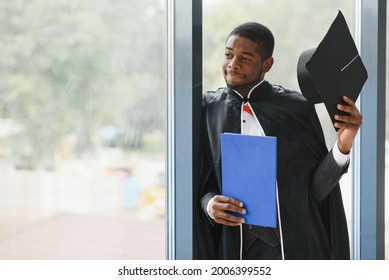 African American Graduate Holding Diploma.