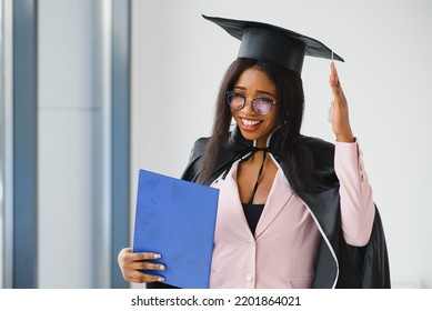 African American Graduate Holding Diploma.