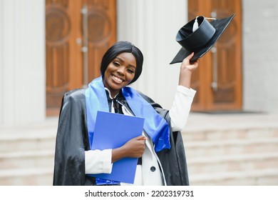 African American Graduate Holding Diploma.