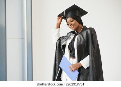 African American Graduate Holding Diploma.