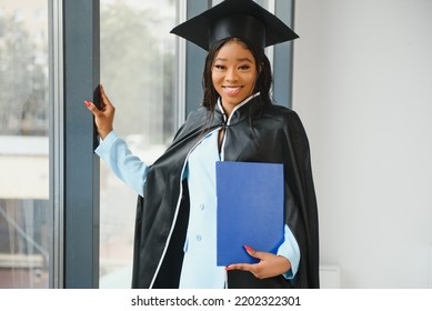 African American Graduate Holding Diploma.